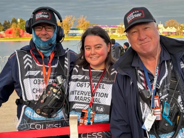 Swampy, Isobel, and Baxter posing at the Australian Grand Prix